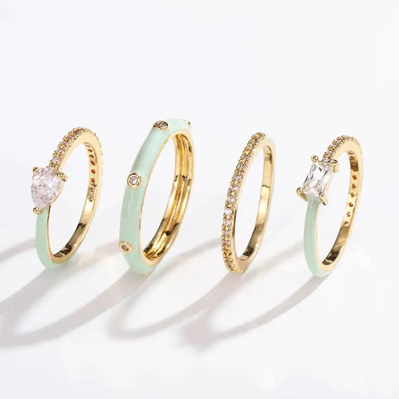 Set of 4 glamorous style rings in pastel tones